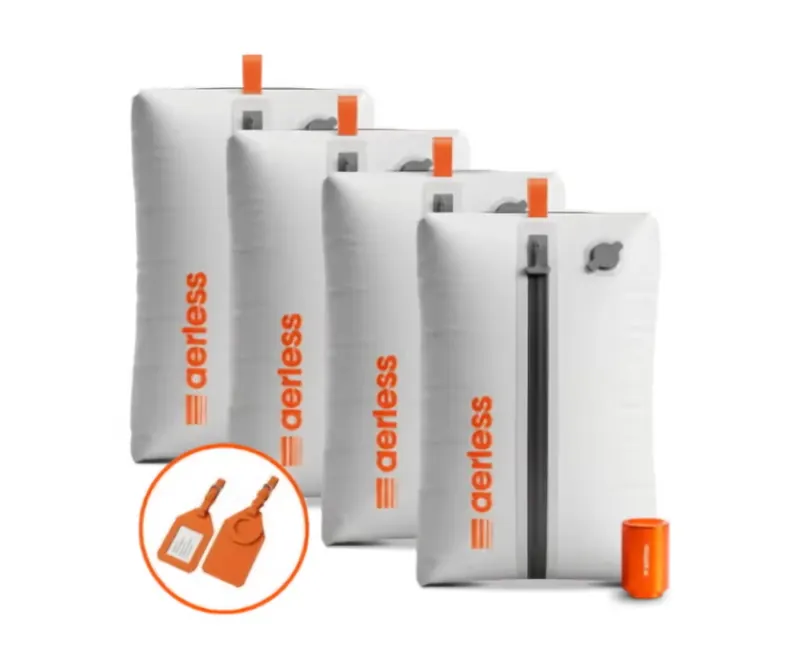 Four Aerless vacuum bags with orange pump and two orange luggage tags