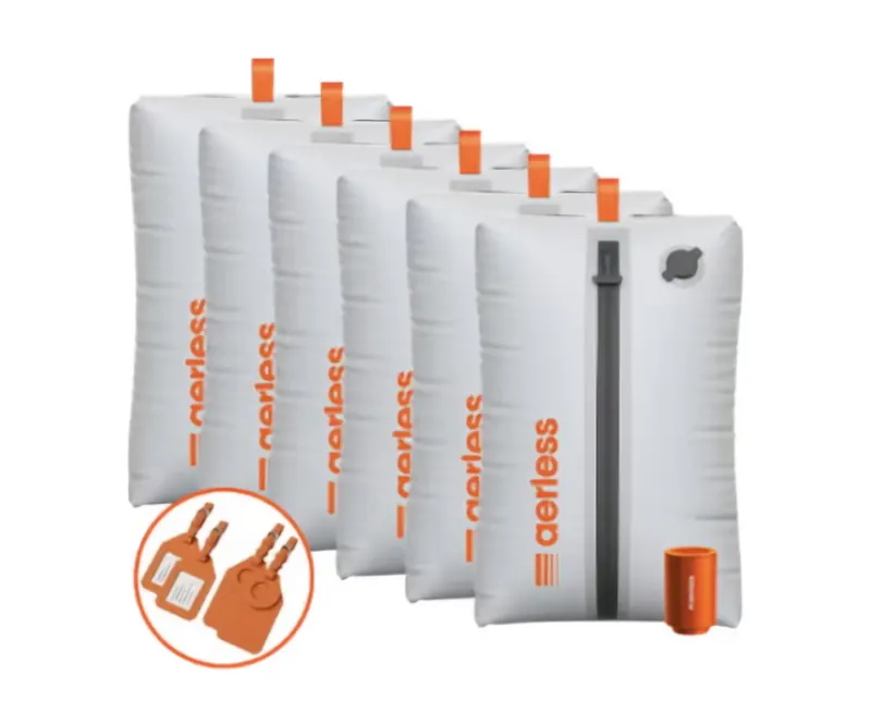 Six Aerless vacuum bags lined up with orange pump and orange luggage tags